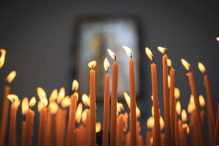 Close-up, candles in the temple on a blurred background